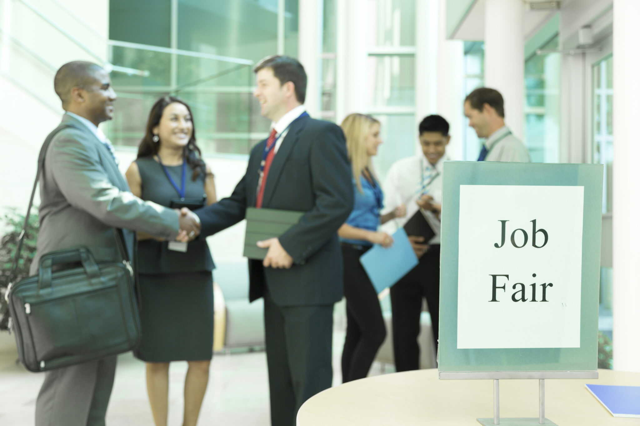 Multi-ethnic group of unemployed, young adult workers attend a local Job Fair.