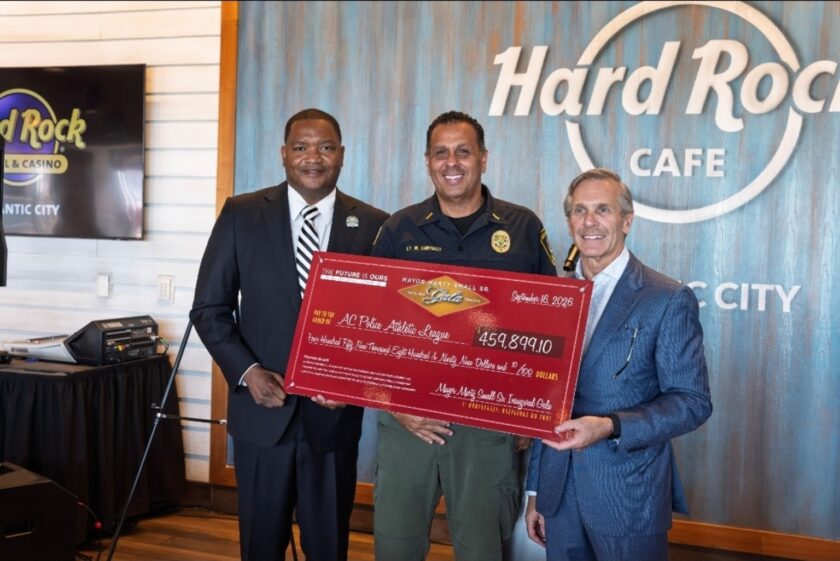 Mayor Marty Small Sr., Atlantic City Police Lt. Mark Santiago and Hard Rock Atlantic City President George Goldhoff hold a ceremonial donation check.