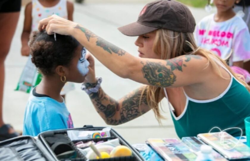 A face painter works with a child at the 48 Blocks Festival in Atlantic City