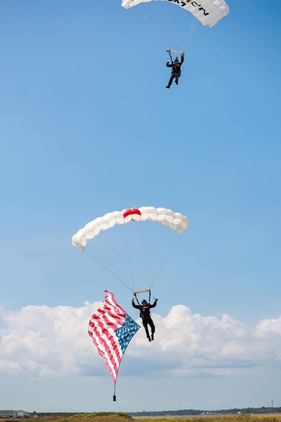 Team Fastrax parachutists descend with an American flag over Ocean City