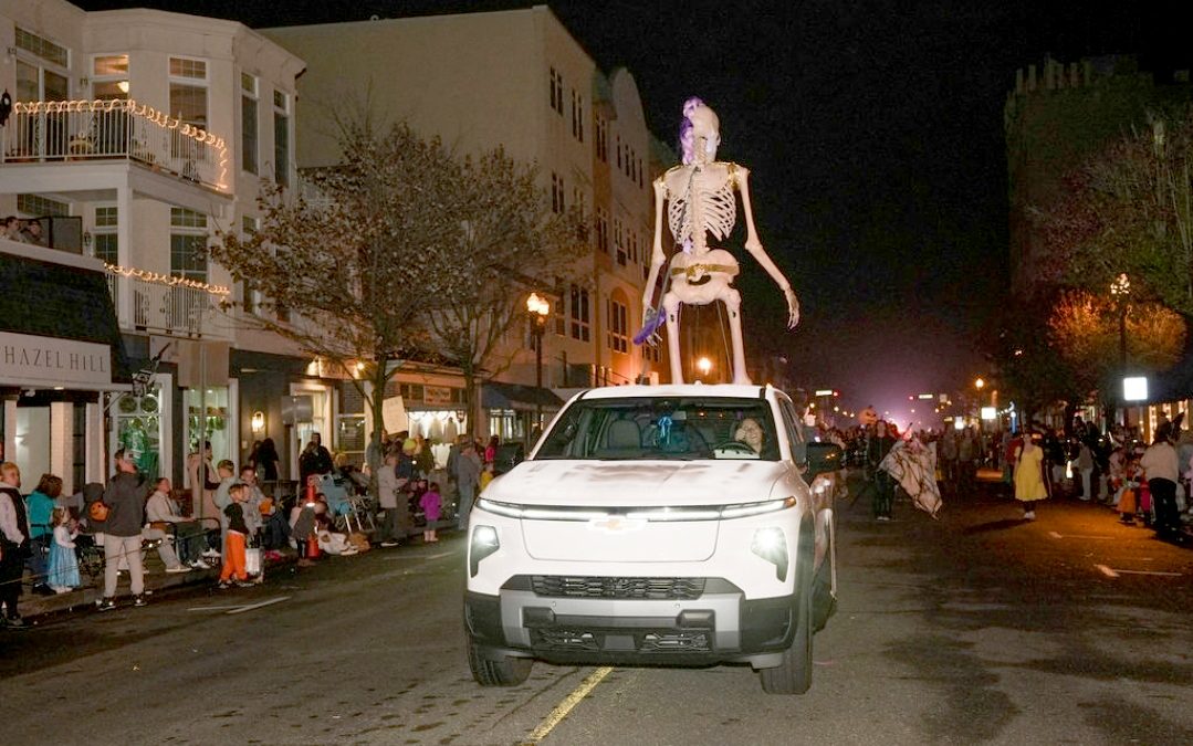 A large skeleton rides atop a vehicle in Ocean City’s nighttime Halloween parade.